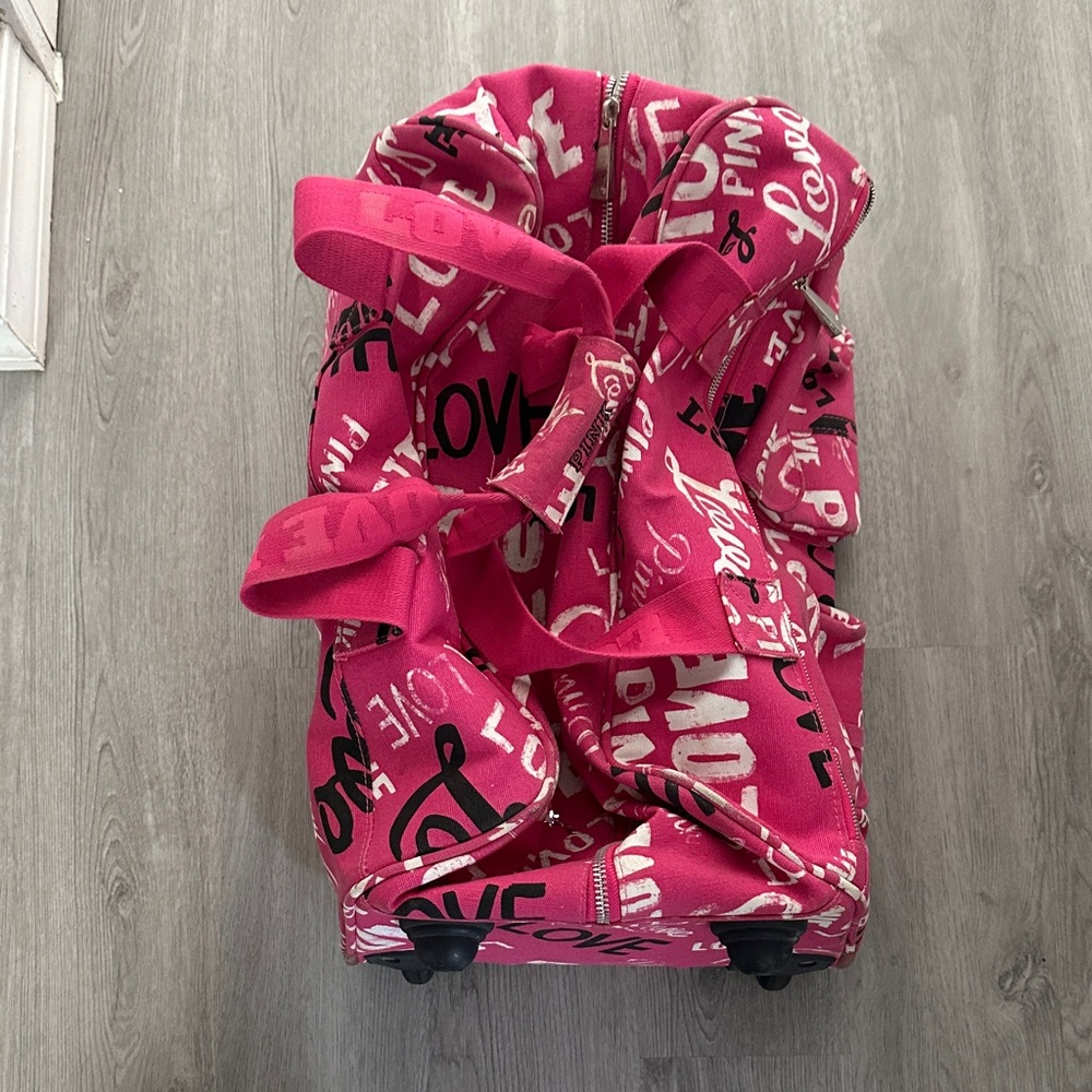 Pink Rolling Duffel Bag with Black and White Print
